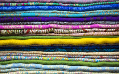 Background of the scrolls rolls colored colorful fabric