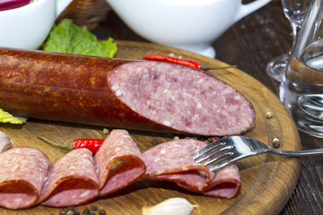 sausage on a wooden plate in a restaurant
