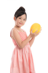 Little asian girl holding melon