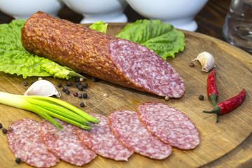 sausage on a wooden plate in a restaurant