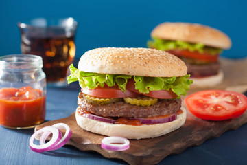 burger with beef patty lettuce onion tomato ketchup