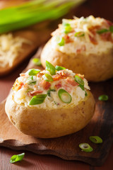 baked potato in jacket with bacon and cheese