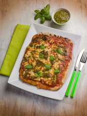 homemade pizza with pesto sauce