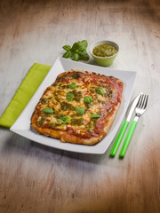 homemade pizza with pesto sauce