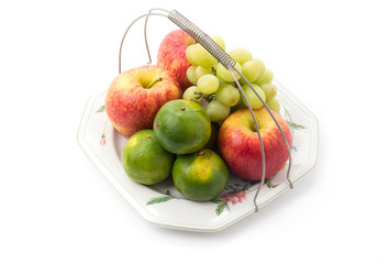 Isolated platter of assorted fruit
