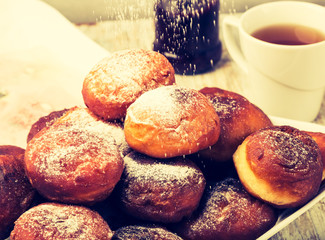 Vintage photo of falling powder sugar on donuts