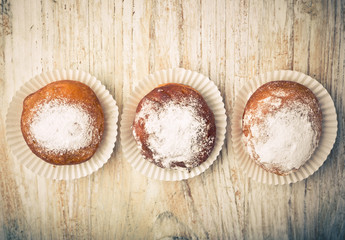 Vintage photo of homemade donuts on white table