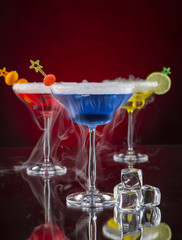 Cocktail with ice vapor on bar desk