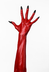 Red Devil's hands, red hands of Satan, white background isolated