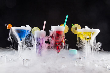 Cocktail with ice vapor on bar desk