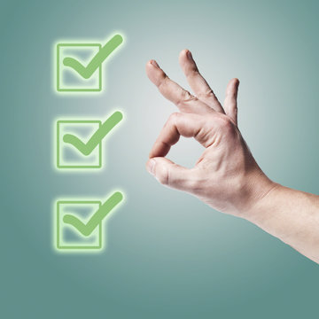 Hand OK sign isolated with three green check marks