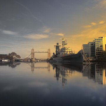 UK, London, HMS Belfast and Tower Bridge seen from water line