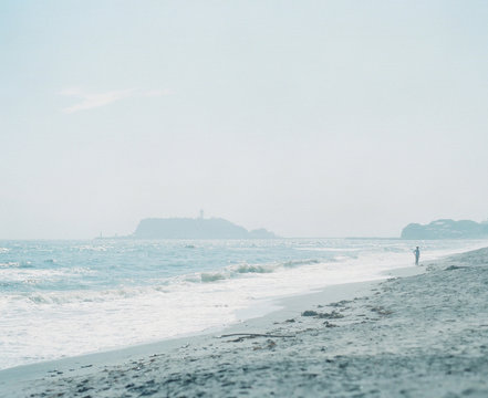 Man Walking On Beach