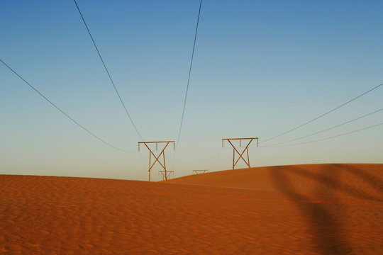Rows of Power lines through a desert landscape, Namib Desert, Namibia