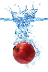 pomegranate splashing in water