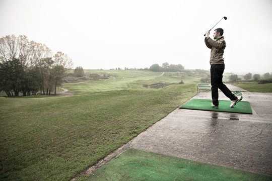 Man playing golf