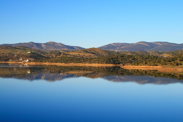 Sky reflected in the lake formed by Montoro dam