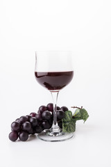 Red wine and grapes