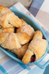 Fresh butter croissants with plum filling.