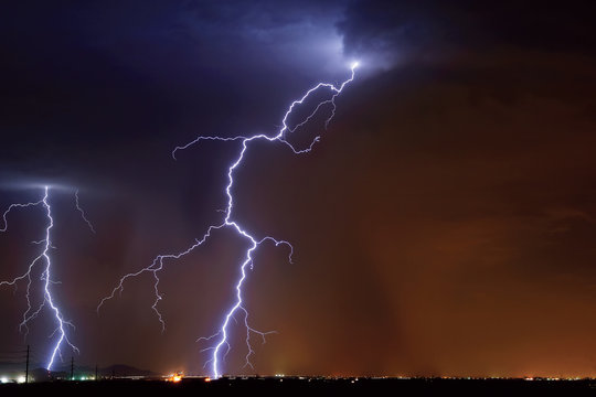 USA, Arizona, Maricopa County, Hassayampa, Lightning striking in farming area near little town 