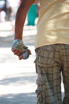 Man holding boule