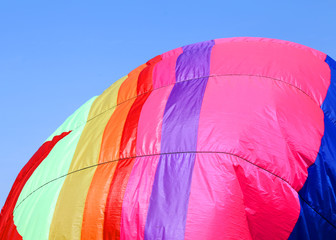 colorful hot air balloon flies in sky blue