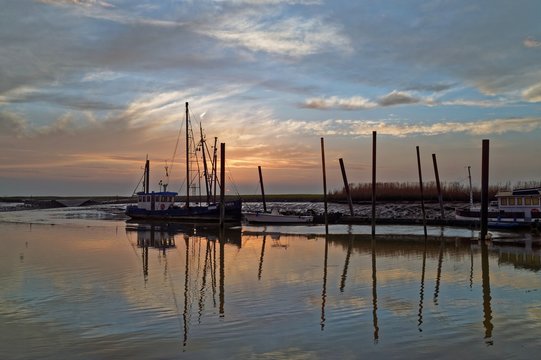 Germany, Petkum, Windless evening in small harbor