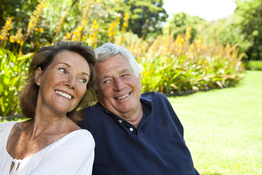 South Africa, Senior couple sitting in the garden