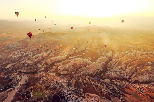 Aerial view of hot air balloons flying in sky