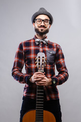 Charismatic musician in glasses and plaid shirt