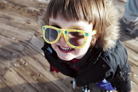 Baby boy (18-23 months) having fun at ski slope