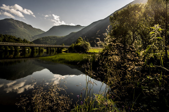 Norway, Borgund, Laerdal, Mountains reflecting in river