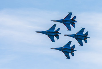 Silhouettes of russian fighter aircrafts SU-27 in the sky