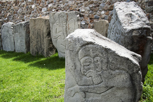 Mexico, Oaxaca, Santa Cruz Xoxocotlan, Monte Alban, Stone slabs with carvings exhibited on grass