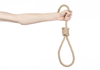 man's hand holding a loop of rope for hanging on isolated
