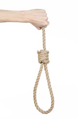 man's hand holding a loop of rope for hanging on isolated