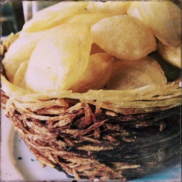 Homemade potato chips in basket