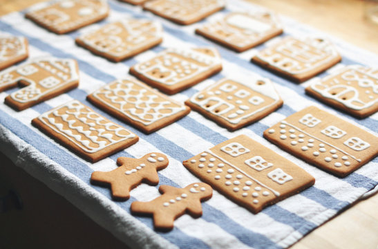 Gingerbread cookies in rows on striped cloth