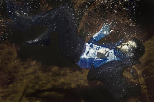 Businessman drowning