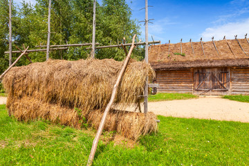 Outdoor hay drying construction near old barn