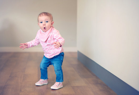 Baby girl learning to balance