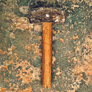 Hammer on weathered surface