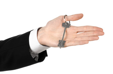 real estate agent  in his hand the key to a new apartment