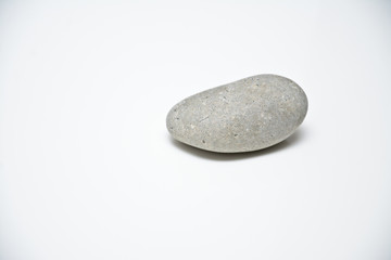 Fototapeta na wymiar gray stone on a white background