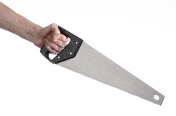 hand holding a saw with a black pen white background isolated