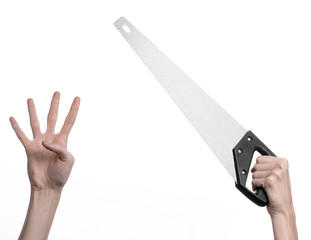 hand holding a saw with a black pen white background isolated