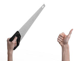 hand holding a saw with a black pen white background isolated
