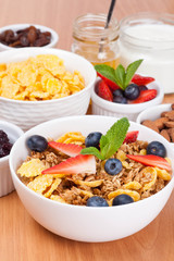 bowl of cornflakes with fresh berries and mint