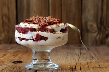 Rye bread tiramisu with cherries, chocolate and silver spoon on
