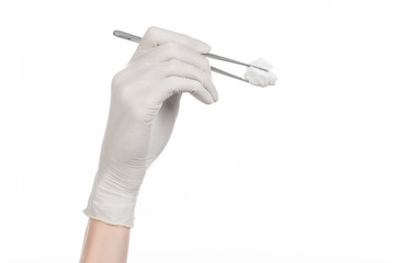 doctor's hand holding tweezers with swab isolated studio